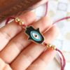 hamsa black evil eye rakhi