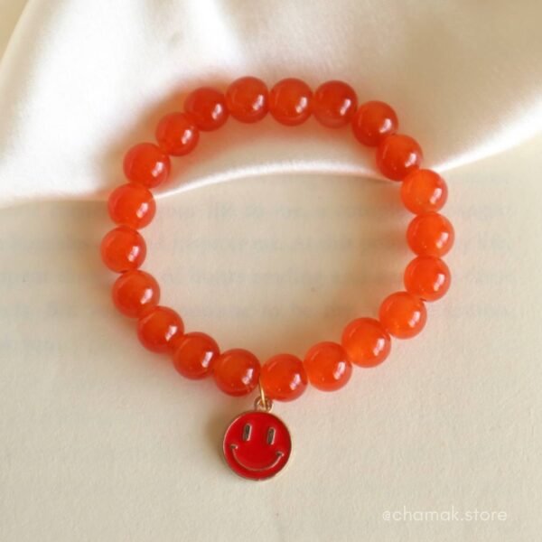 Orange Bracelet With Red Smiley Charm