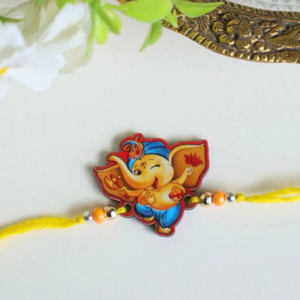 Ganesha With Modak Wooden Rakhi