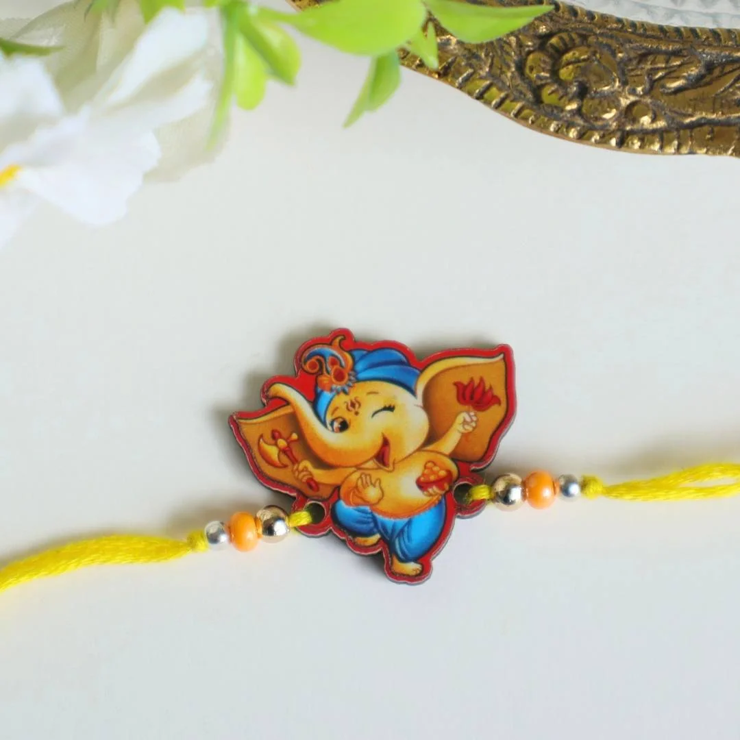 Ganesha With Modak Wooden Rakhi