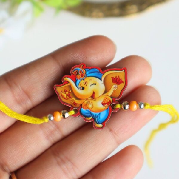 Ganesha With Modak Wooden Rakhi