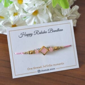 Soft Pink Stone Rakhi with Golden Accents