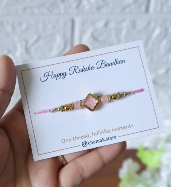 Soft Pink Stone Rakhi with Golden Accents