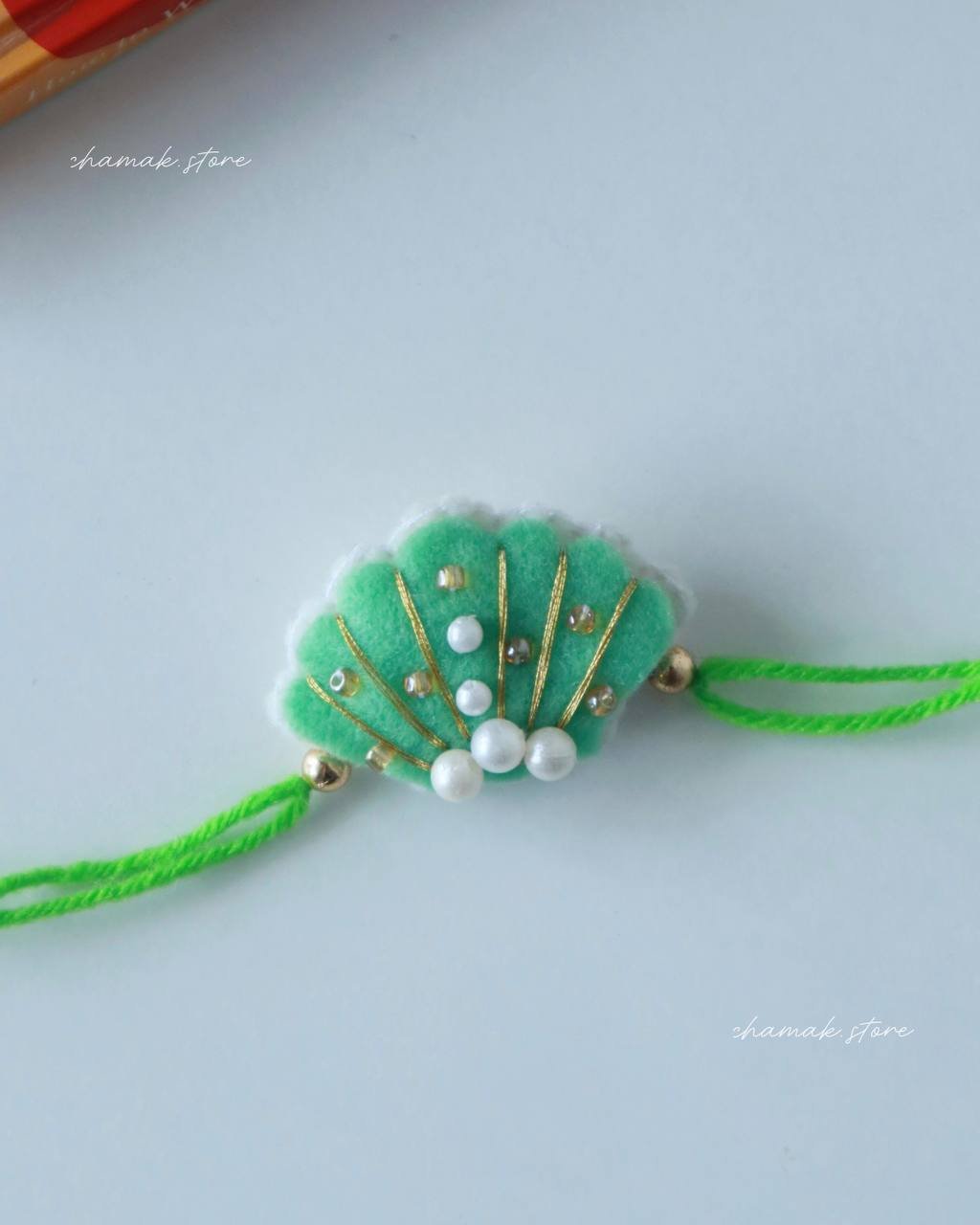 Handmade Green Pearl Shell Rakhi
